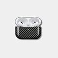 Classic Black Karbon™ 2x2 Twill Woven Carbon Fiber AirPods Case front view showing the high-gloss composite finish.