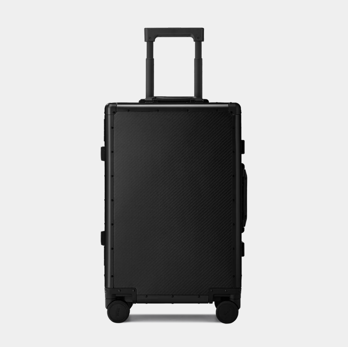 Karbon™ Lightweight Carbon Fiber 20-inch and 24-inch hardside spinner suitcases featuring a reinforced aluminum frame and dual TSA locks on a studio background.