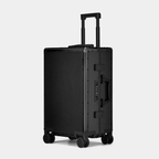 Karbon™ Lightweight Carbon Fiber 20-inch and 24-inch hardside spinner suitcases featuring a reinforced aluminum frame and dual TSA locks on a studio background.