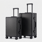 Karbon™ Lightweight Carbon Fiber 20-inch and 24-inch hardside spinner suitcases featuring a reinforced aluminum frame and dual TSA locks on a studio background.