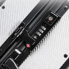 Karbon™ Lightweight Silver Carbon Fiber 20-inch and 24-inch hardside spinner suitcases featuring a reinforced aluminum frame and dual TSA locks on a studio background.
