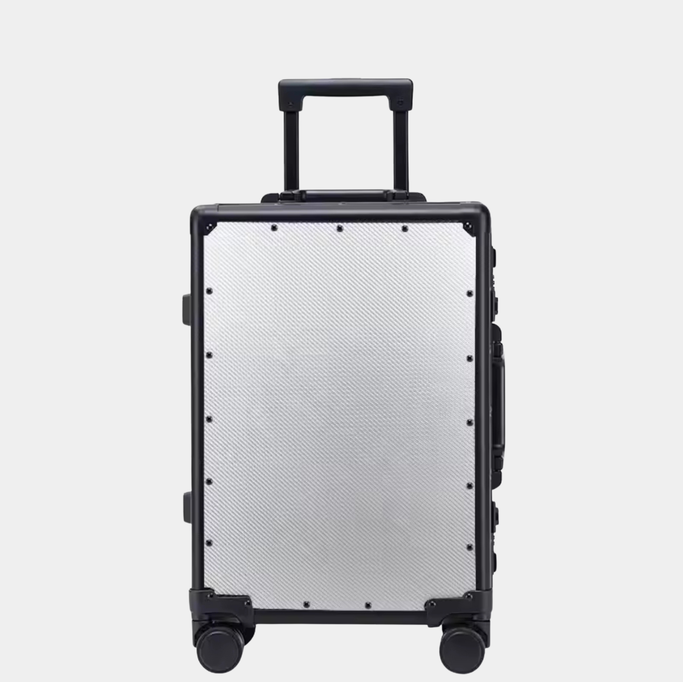 Karbon™ Lightweight Silver Carbon Fiber 20-inch and 24-inch hardside spinner suitcases featuring a reinforced aluminum frame and dual TSA locks on a studio background.