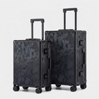 Karbon™ Lightweight camo Carbon Fiber 20-inch and 24-inch hardside spinner suitcases featuring a reinforced aluminum frame and dual TSA locks on a studio background.