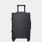Karbon™ Lightweight grid Carbon Fiber 20-inch and 24-inch hardside spinner suitcases featuring a reinforced aluminum frame and dual TSA locks on a studio background.