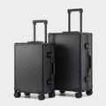 Karbon™ Lightweight grid Carbon Fiber 20-inch and 24-inch hardside spinner suitcases featuring a reinforced aluminum frame and dual TSA locks on a studio background.