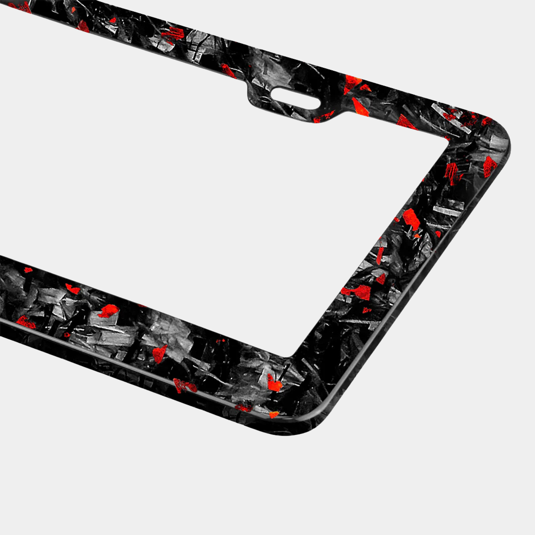 Karbon Technik red coloured forged carbon car licence plate frame, detail view.