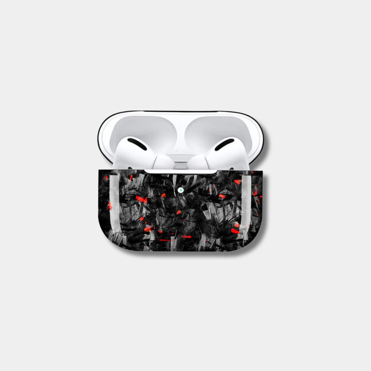 Apple AirPods case made from genuine forged carbon fiber with vibrant red specks by Karbon Technik, displaying a high-gloss marbled composite finish.