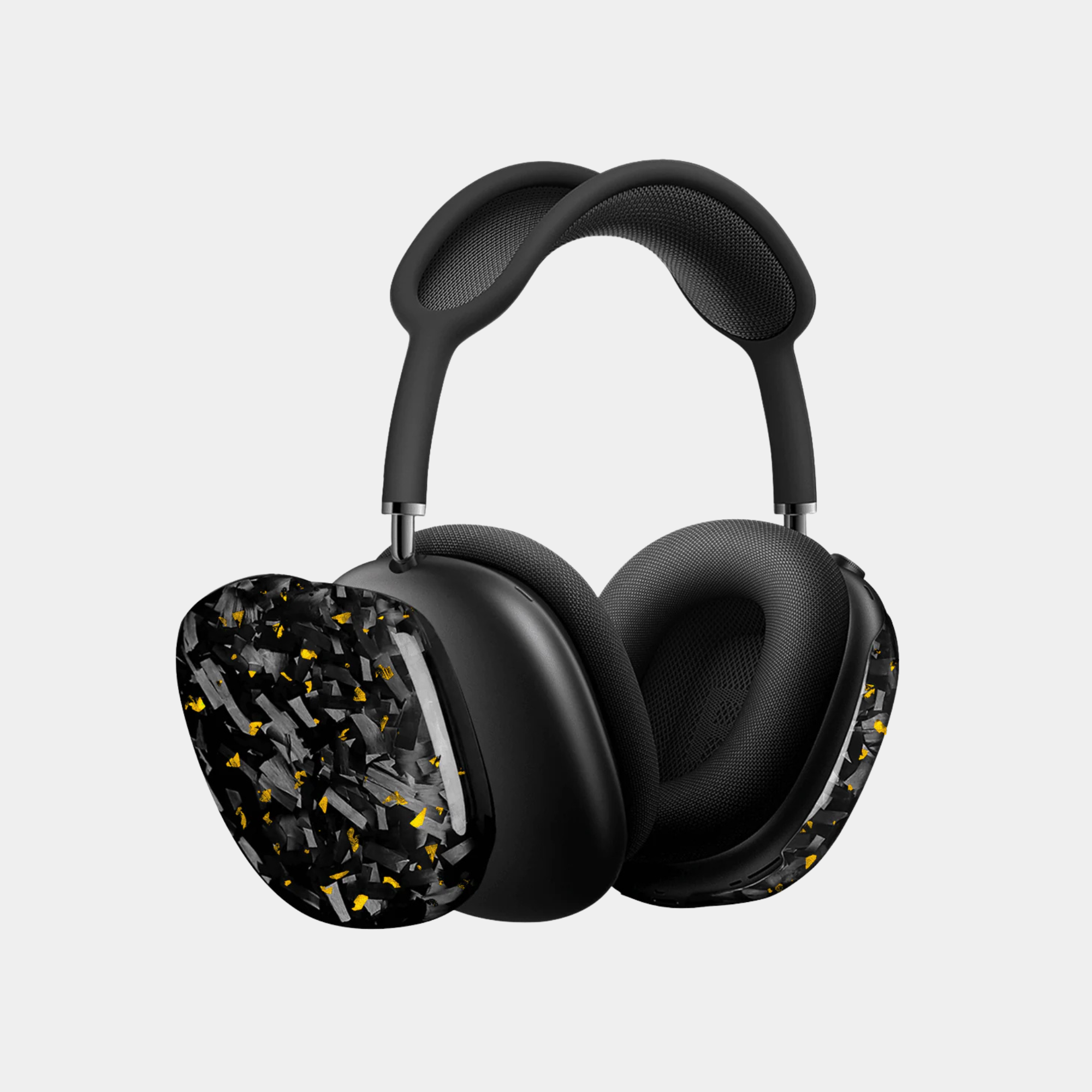 Apple AirPods Max with gold-accented forged carbon fiber covers by Karbon Technik, showcasing a high-gloss marbled composite finish.