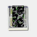 Forged Karbon™ money clip in black composite with green accents holding bills by Karbon Technik.