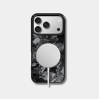 Genuine Forged Carbon Fiber protective case for an iPhone featuring a unique black forged pattern, built-in MagSafe, and precision cutouts.