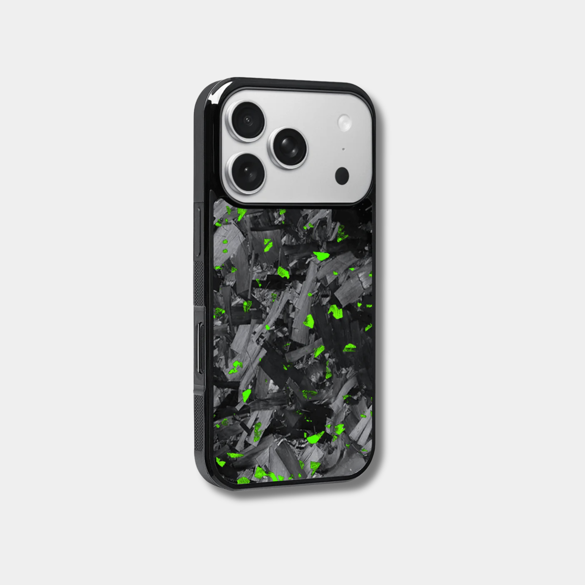 Genuine forged carbon fiber iPhone case by Karbon Technik, featuring vibrant green flakes, protective raised edges, and MagSafe compatibility.