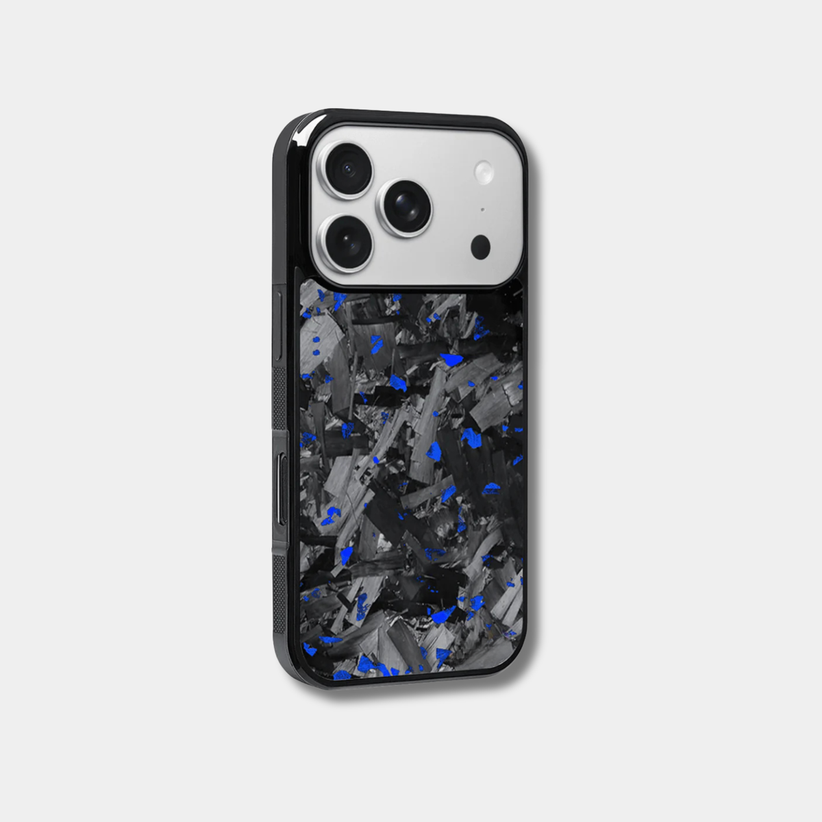 Genuine forged carbon fiber iPhone case by Karbon Technik, featuring vibrant blue flakes, protective raised edges, and MagSafe compatibility.