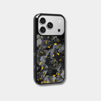 Genuine forged carbon fiber iPhone case by Karbon Technik, featuring vibrant gold flakes, protective raised edges, and MagSafe compatibility.