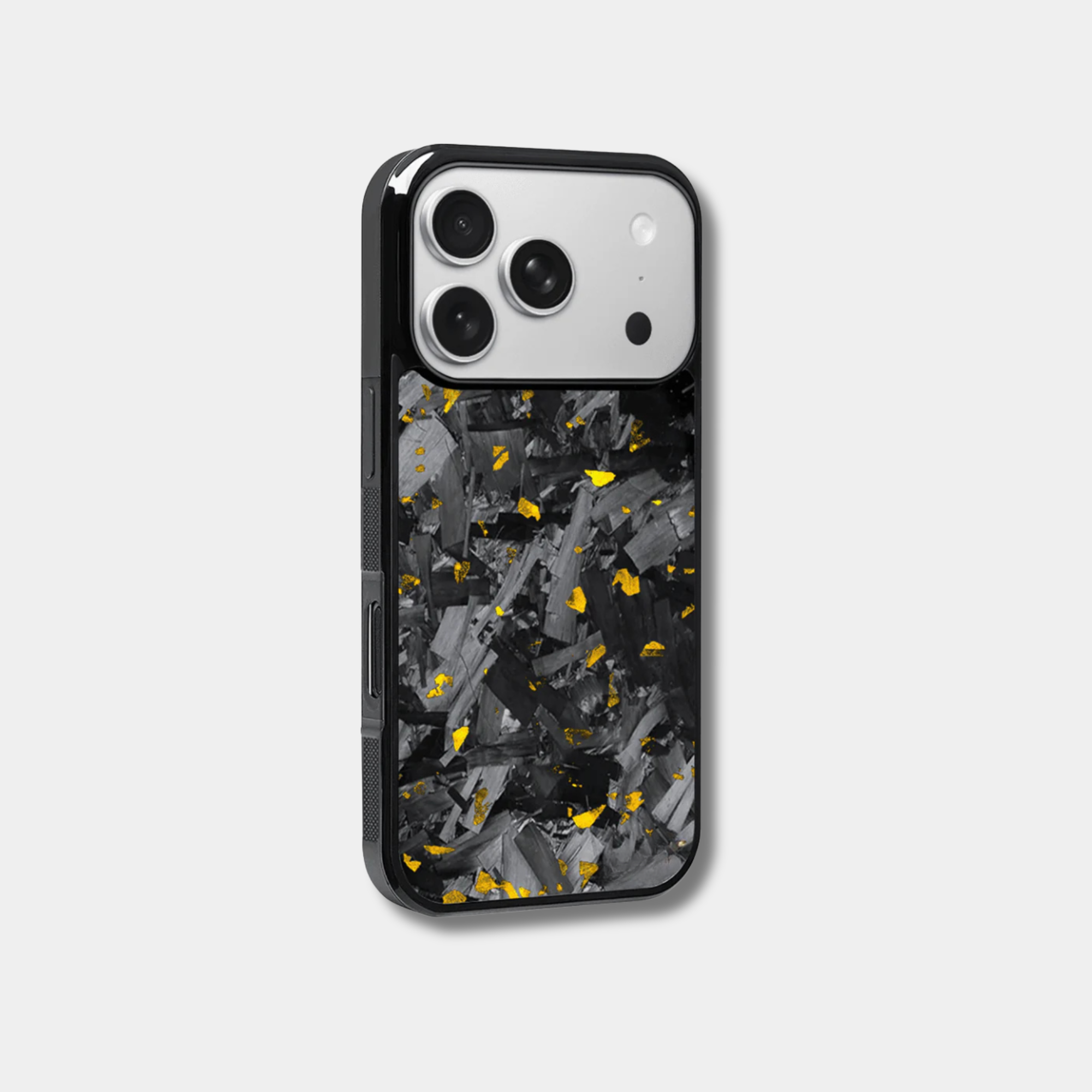 Genuine forged carbon fiber iPhone case by Karbon Technik, featuring vibrant gold flakes, protective raised edges, and MagSafe compatibility.