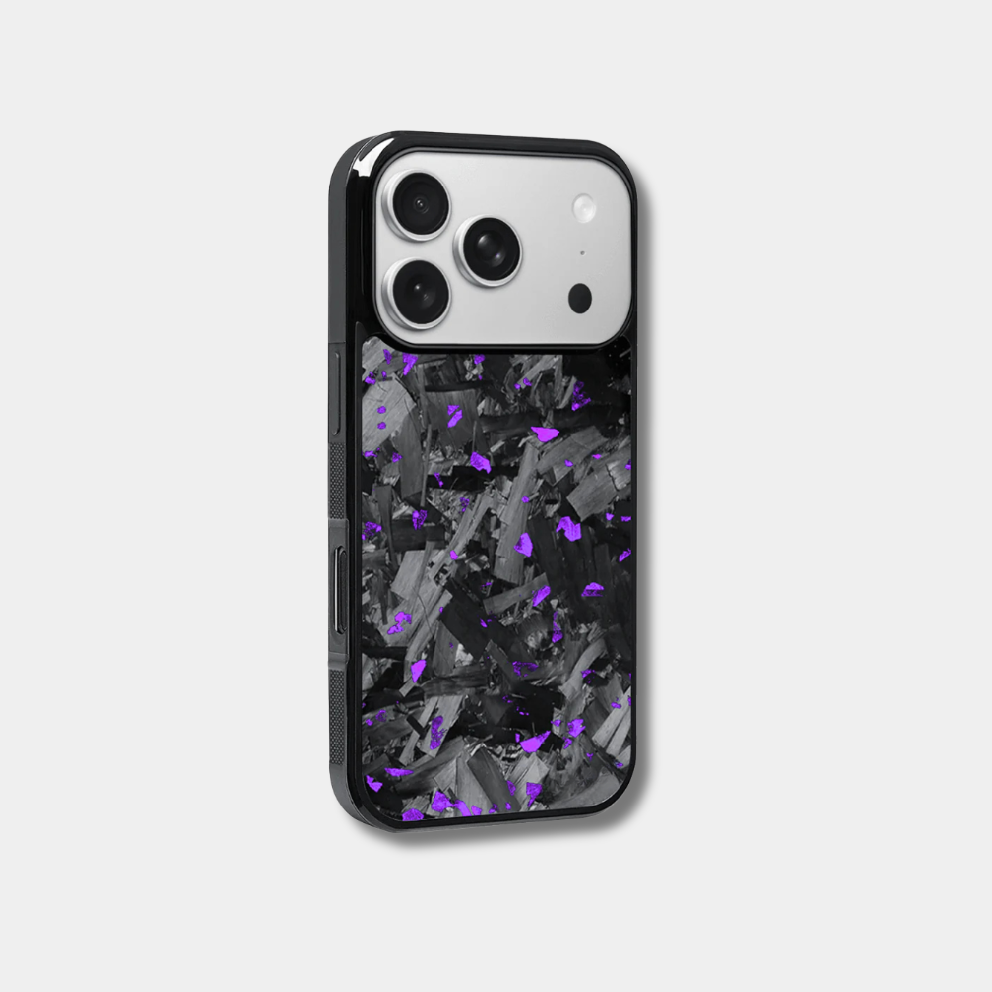Genuine forged carbon fiber iPhone case by Karbon Technik, featuring vibrant purple flakes, protective raised edges, and MagSafe compatibility.