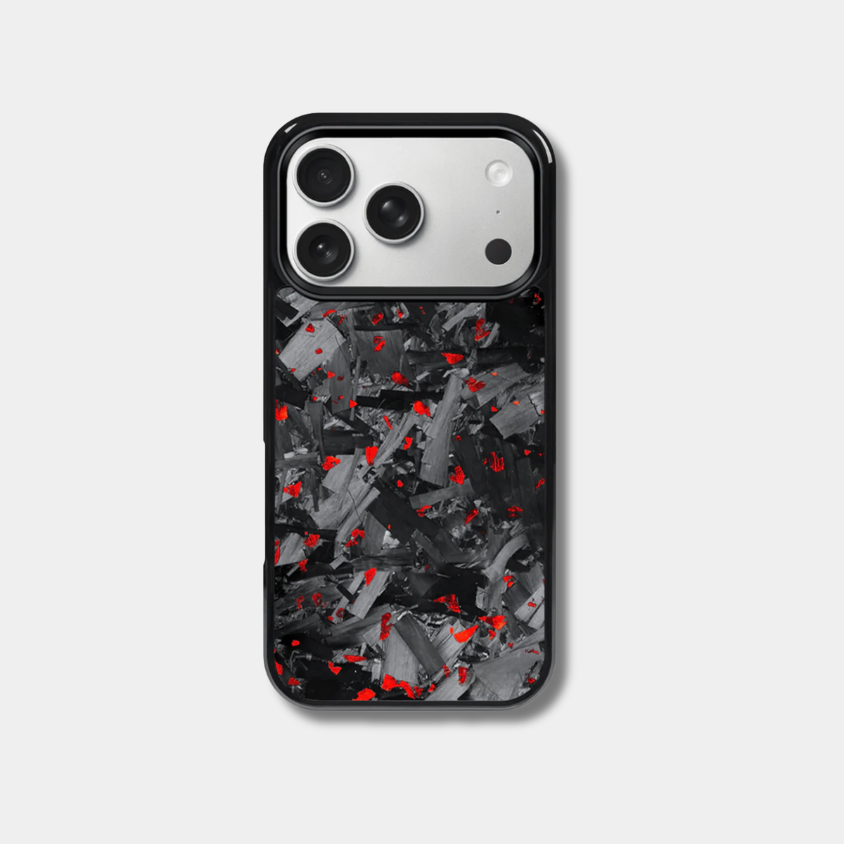 Genuine forged carbon fiber iPhone case by Karbon Technik, featuring vibrant red flakes, protective raised edges, and MagSafe compatibility.