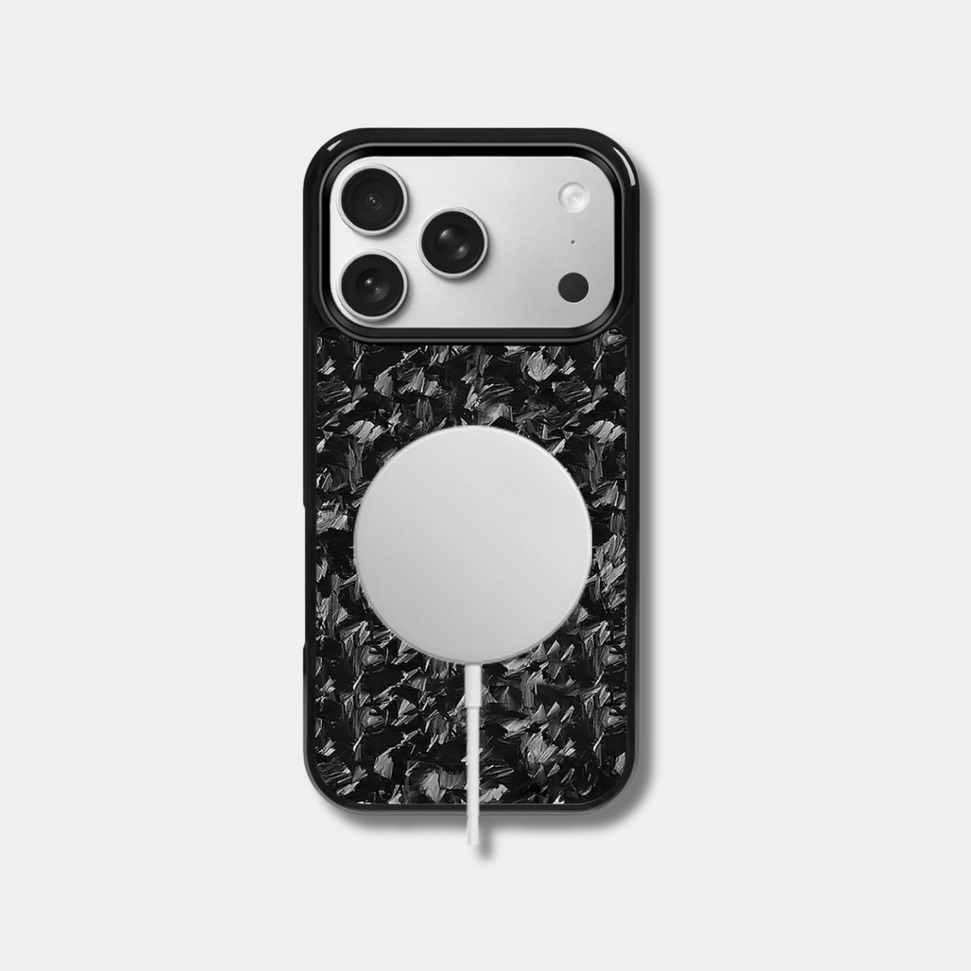 Genuine raw carbon fiber iPhone case by Karbon Technik, featuring protective raised edges, and MagSafe compatibility.