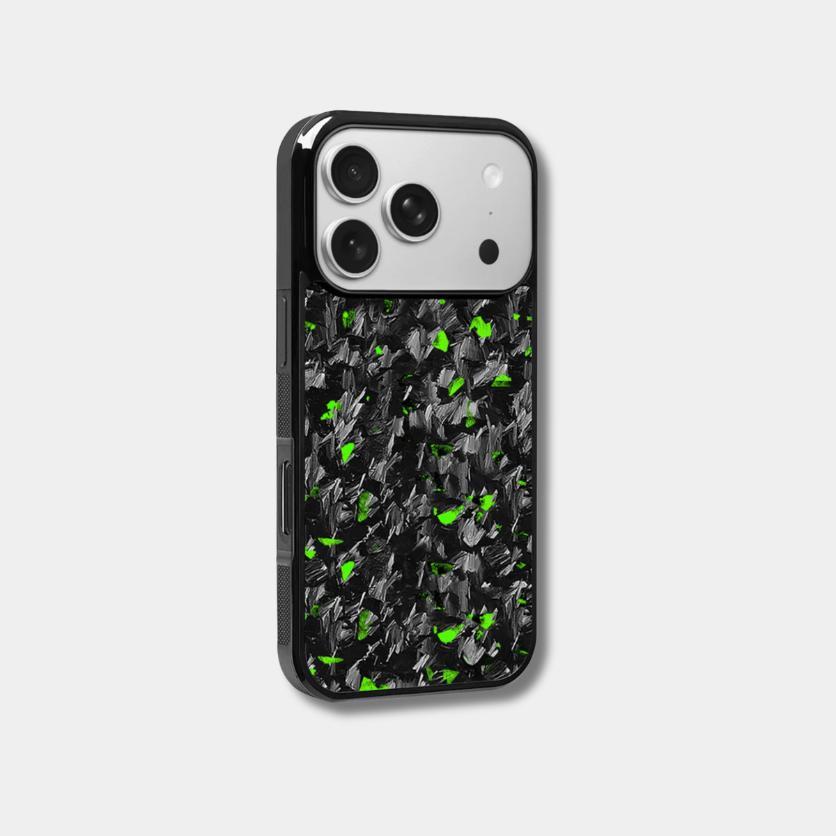 Genuine raw carbon fiber iPhone case by Karbon Technik, featuring vibrant green flakes, protective raised edges, and MagSafe compatibility. 