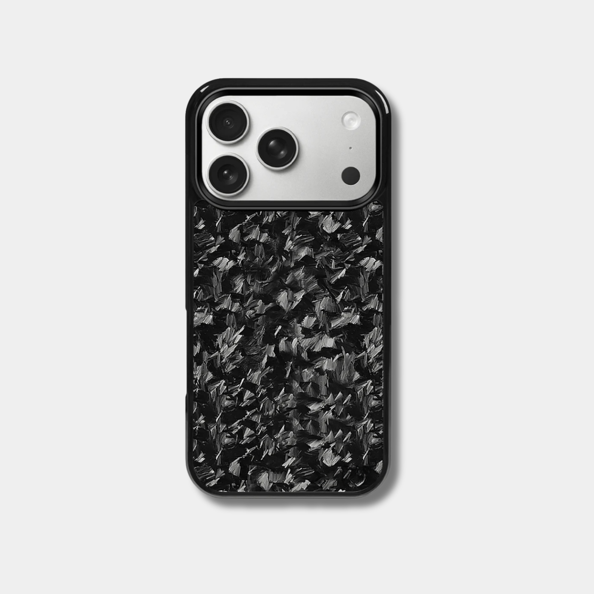 Genuine raw carbon fiber iPhone case by Karbon Technik, featuring protective raised edges, and MagSafe compatibility.