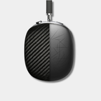 Pair of black Apple AirPods Max with genuine woven carbon fiber earcup covers by Karbon Technik, displaying a classic 3D twill composite finish.