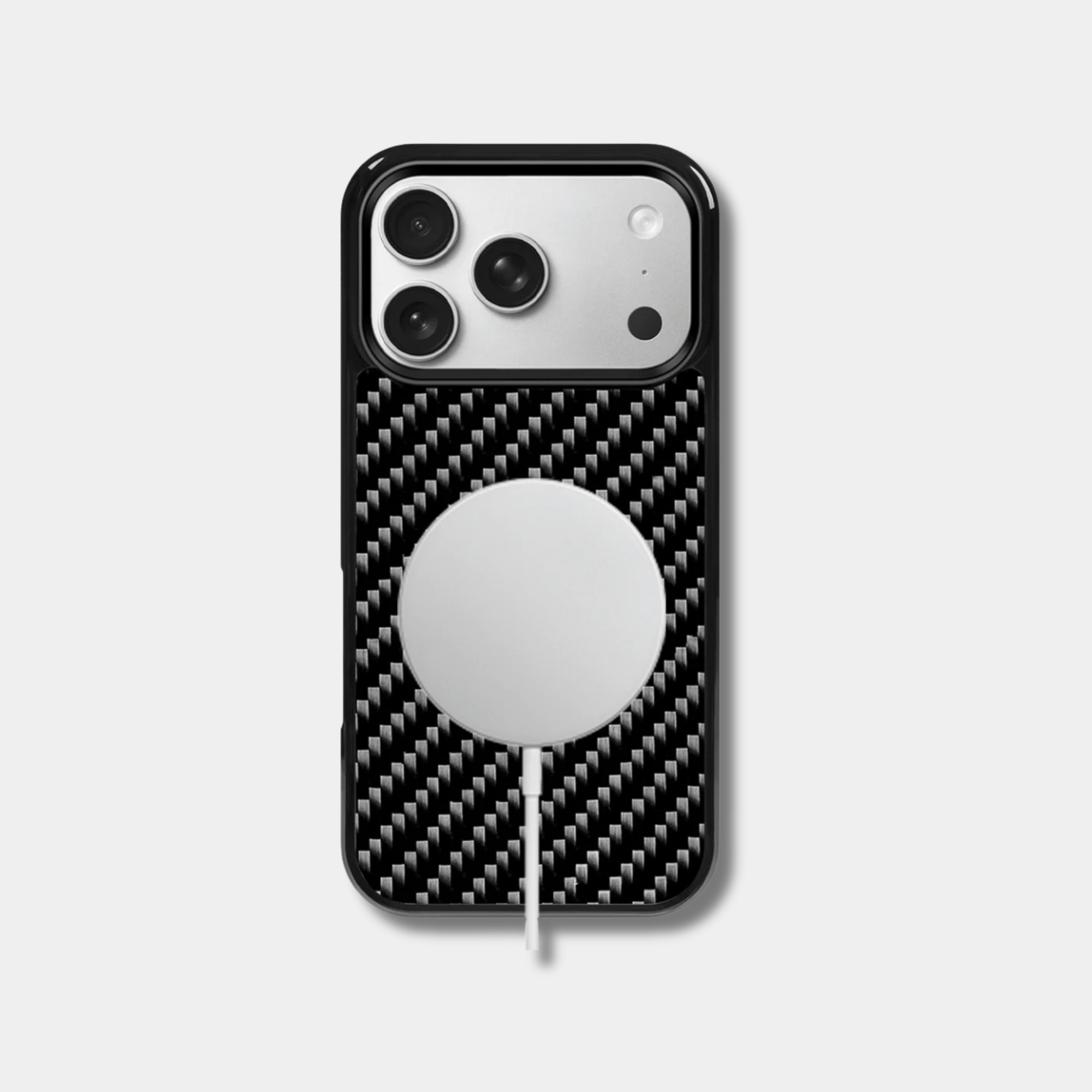 Black woven carbon fiber iPhone case by Karbon Technik with raised camera bezel and high-impact protective TPU frame.