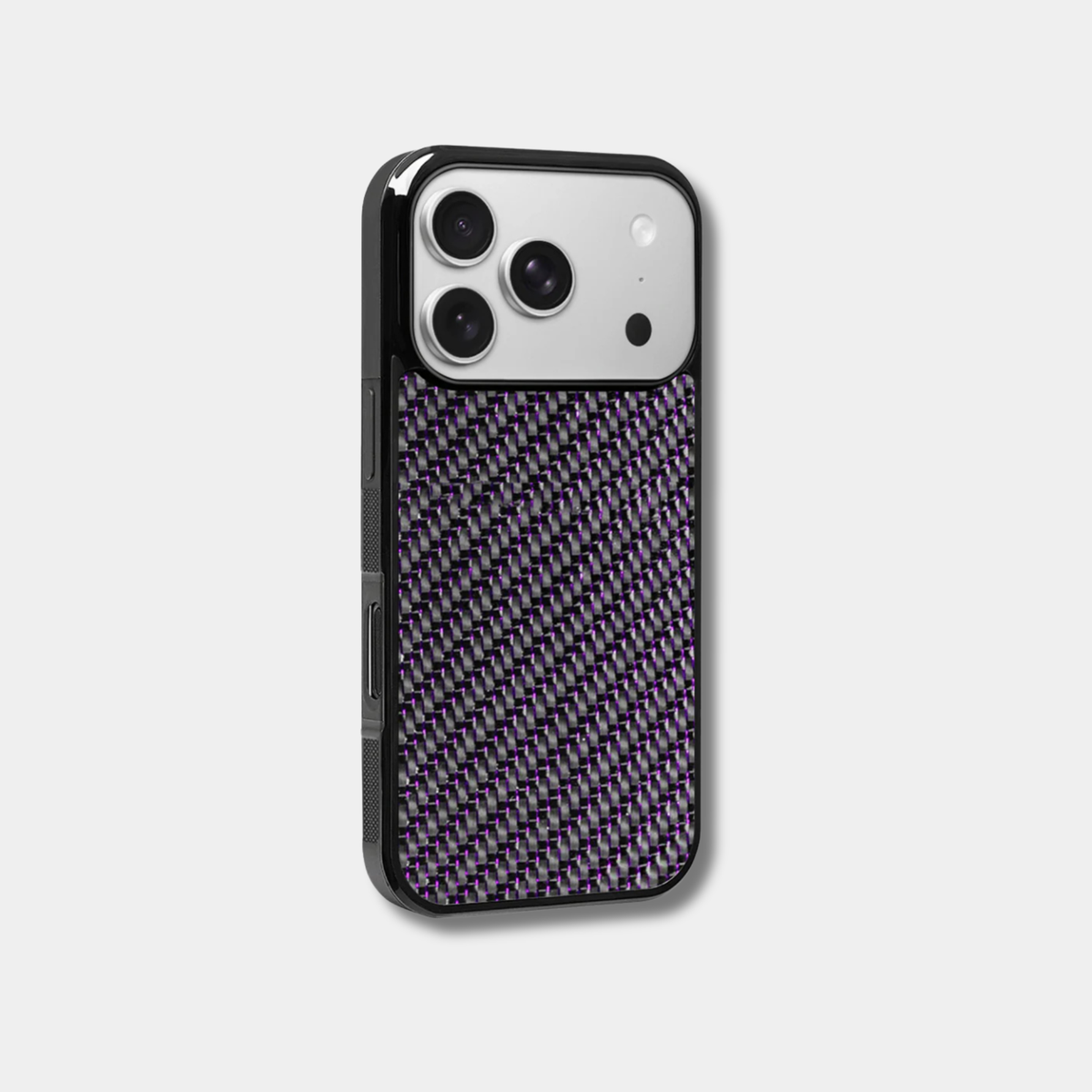 Purple-accented woven carbon fiber iPhone case by Karbon Technik with raised camera bezel and high-impact protective TPU frame.